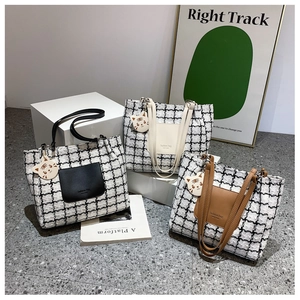 Three checkered tweed tote bags with leather handles and cute tiger charm detail