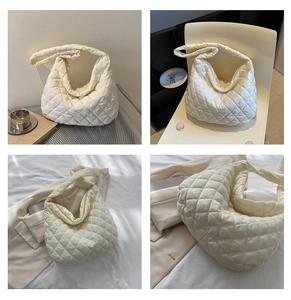 Detail view of large quilted cloud bag showing spacious interior and soft fabric textures