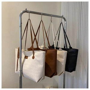 Collection of minimalist textured tote bags in white, brown, beige, and black colors