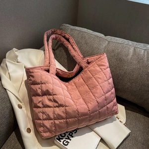 Chic pink quilted tote bag with diamond stitching and elegant gold magnetic closure