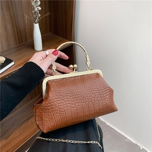 Vintage brown crocodile pattern clasp bag with golden metal handle and chain strap