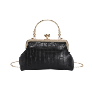 Vintage black faux crocodile pattern kiss lock bag with golden floral handle and chain