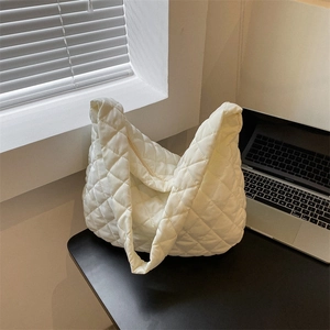 White quilted cloud shoulder bag featuring a large capacity and casual commuter style