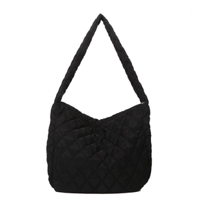 Black quilted puffer hobo bag with classic diamond stitch pattern and wide shoulder strap