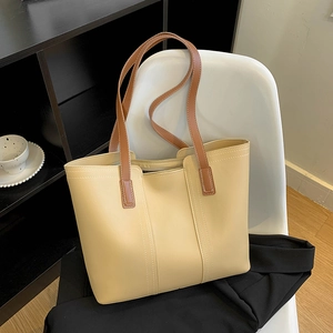 Large vintage cream tote bag with brown straps for daily commuting and college students