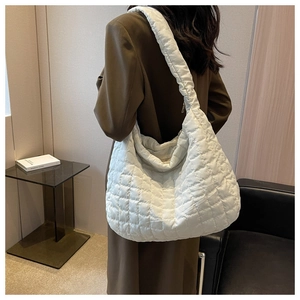 Close-up of white quilted space cotton tote bag showing large capacity and soft texture