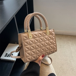 Minimalist beige quilted shoulder bag with woven handle and elegant gold chain strap