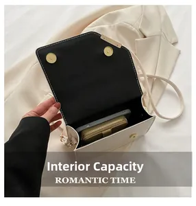 Internal capacity of beige crossbody bag showing space for a smartphone and wallet