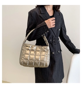 Champagne gold quilted down shoulder bag with glossy nylon texture and grid stitching detail