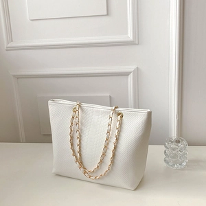 Chic white croc-embossed tote bag for women featuring stylish gold chain handle detail