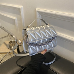 Silver quilted crossbody bag with acrylic chain and metallic finish for women