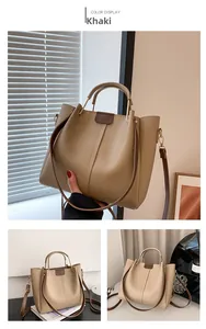 Detail of khaki PU leather tote bag showing side wings and adjustable shoulder strap