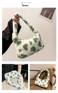 Detail of green heart pattern on soft white plush tote bag with a zipper closure