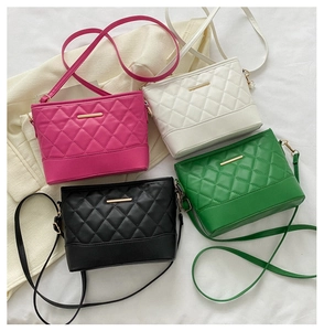 Detailed close-up of quilted PU leather crossbody bags in four vibrant colors with gold metal trim