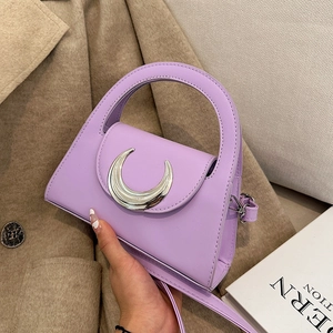 Lavender faux leather crossbody bag with silver crescent moon buckle and top handle