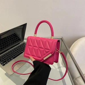 Quilted geometric rose pink crossbody bag with woven handle and gold chain hardware
