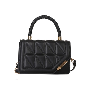 Quilted black handbag with triangle patterns, woven handle, and gold metal accents