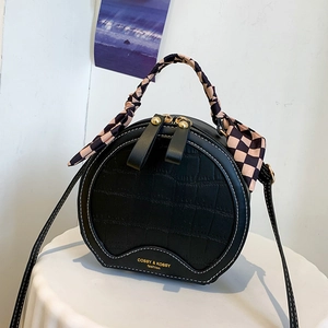 Fashionable black round handbag with crocodile texture and checkerboard silk scarf handle