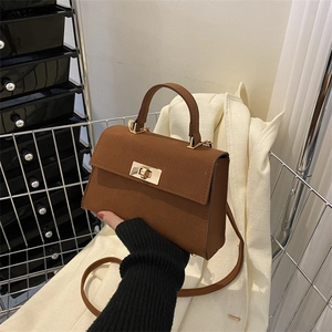 Vintage dark brown crossbody bag with gold twist lock and single handle design