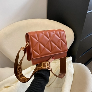 Brick red quilted square crossbody bag with adjustable jacquard pattern wide shoulder strap