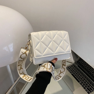 White quilted crossbody bag with golden hardware and wide fabric shoulder strap