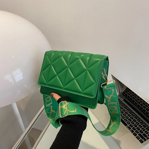 Green quilted crossbody bag with diamond lattice pattern and stylish wide shoulder strap