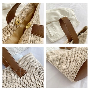 Detail view of woven straw bucket bag with magnetic clasp and brown leather straps