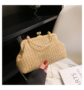 Detailed view of straw weave texture and gold kiss-lock metal frame on retro clutch bag
