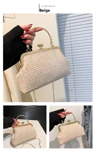 Detail of beige woven evening bag with vintage metal clasp and floral ring handle