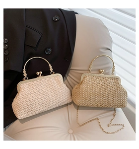 Detail view of woven straw shell bags with gold handles in beige and khaki colors