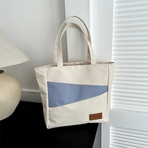 Large Oxford fabric bucket tote bag with blue and white patchwork in casual style