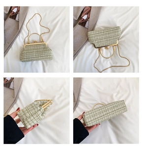 Detail of dark green tweed crossbody bag with golden frame and pearl clasp closure