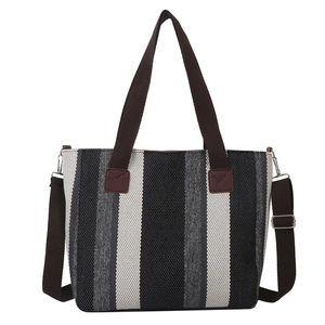 Minimalist striped canvas tote bag with brown handles and detachable shoulder strap