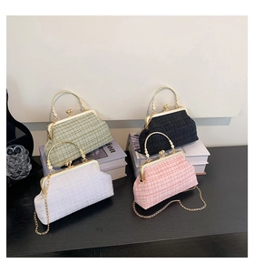 Group display of tweed chain bags in green, black, white, and pink with gold handles