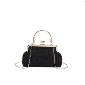 Elegant black tweed shell handbag with gold circular handle and detachable chain strap