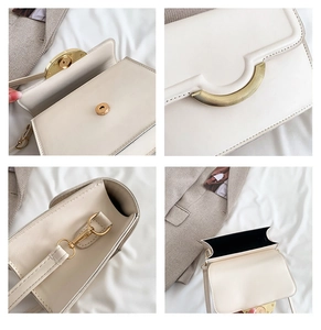 Detail view of cream flap bag showing gold hardware, magnetic closure and interior lining