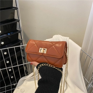 Classic brown quilted shoulder bag with golden chain strap and rectangular turn-lock
