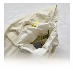 Internal view of beige puffy bubble tote bag showing large capacity for umbrella and phone