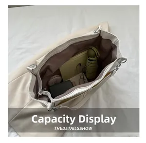 Large capacity tote bag interior showing daily essentials and zip closure detail