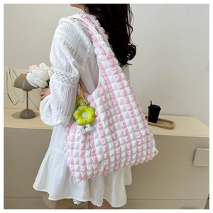 Pink and white striped puffy tote bag featuring soft bubble texture and sunflower charm