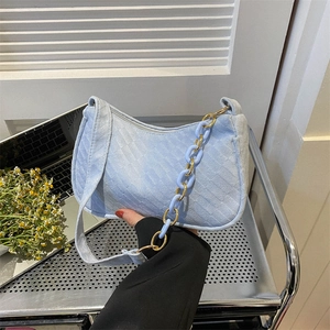 Sky blue textured shoulder bag with chic chunky plastic chain and gold metal buckle