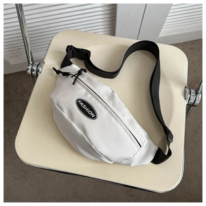 Detail of a minimalist white nylon crossbody bag with fashion logo and black strap