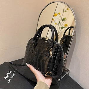 Classic black stone-pattern shell handbag with glossy texture and elegant gold hardware