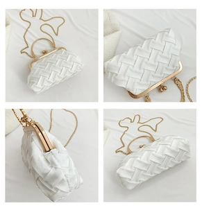Detail showing the white woven texture and vintage gold kiss-lock frame of this evening bag