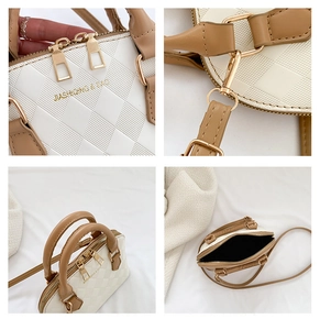 Detail of white checkered embossed leather bag with gold hardware and brown straps