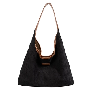Minimalist black quilted canvas tote bag with brown leather straps and large capacity