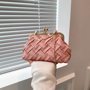 Pink woven satin evening clutch bag with gold chain handle and vintage metal clasp
