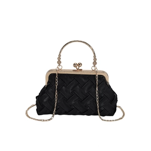 Elegant black pleated evening clutch with golden circular handle and metal chain strap
