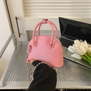 Pink lychee textured mini shell handbag with silver bead chain and fashion logo