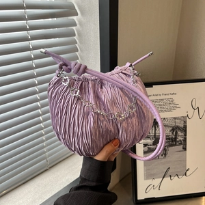Fashionable lavender pleated handbag with silver floral chain and knotted handle